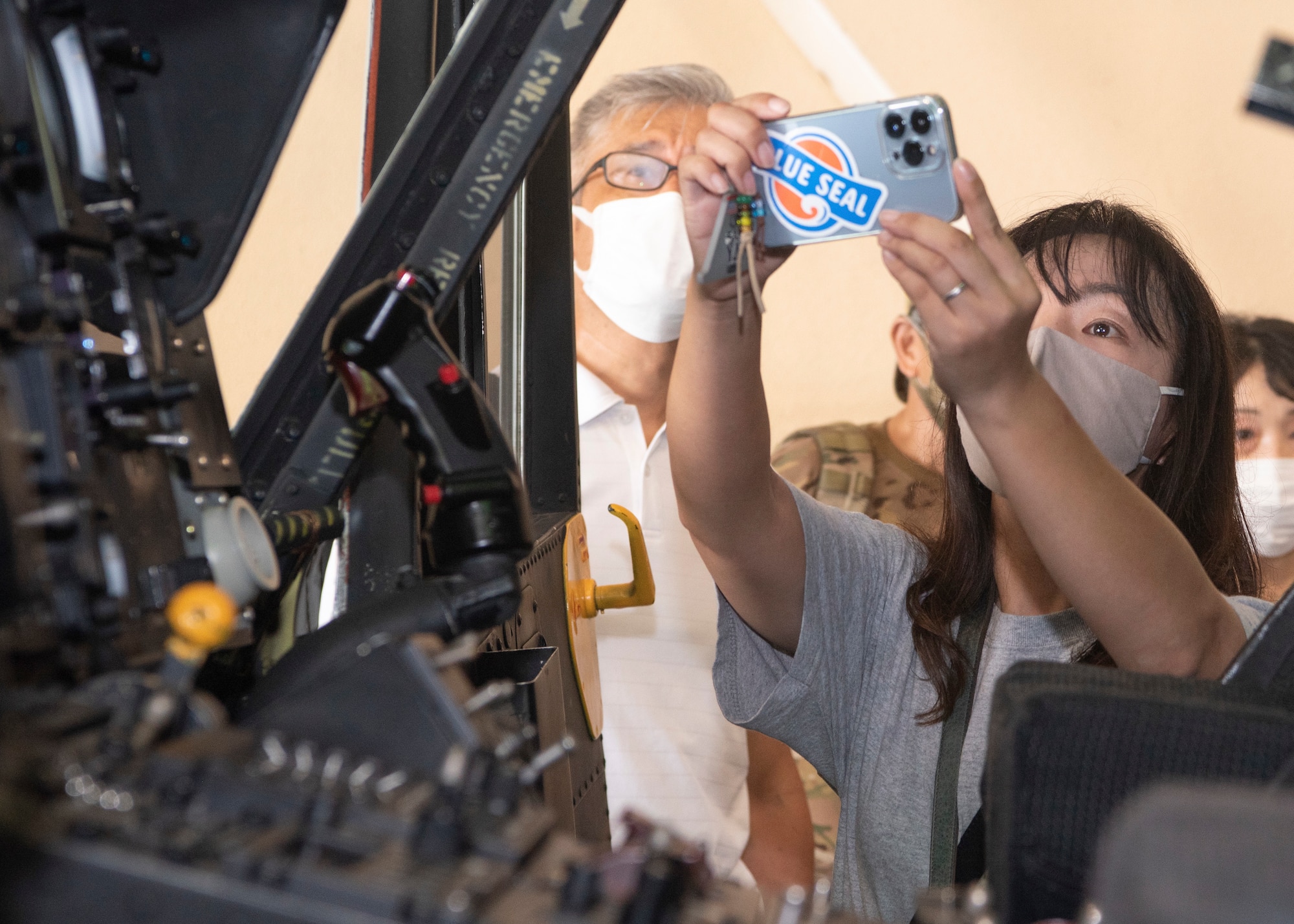 An aviation enthusiast takes a photo of the cockpit of a UH-1N Iroquois during a tour at Yokota Air Base, Japan, Aug. 31, 2022.