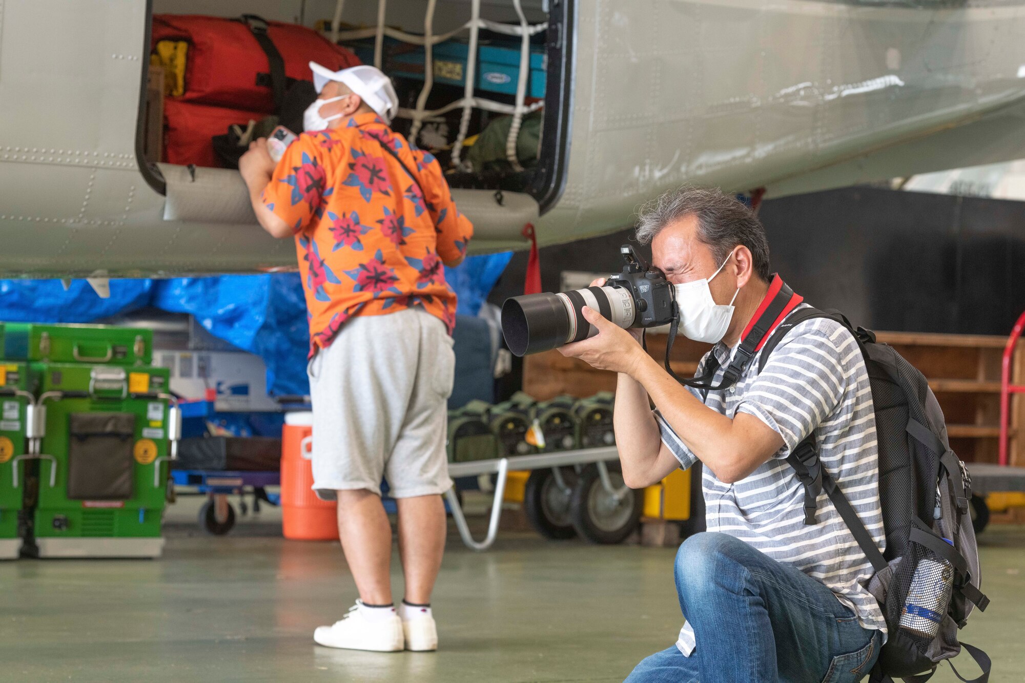 A local aviation enthusiast takes a photo of a C-12J Huron during a tour at Yokota Air Base, Japan, Aug. 31, 2022.