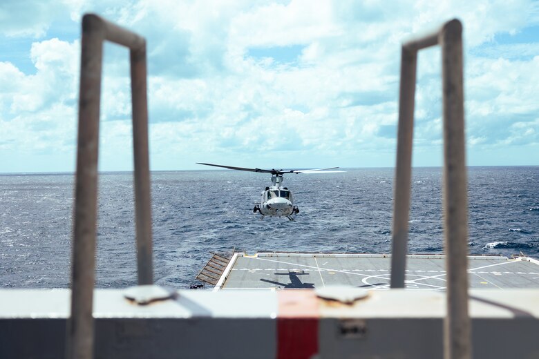 A U.S. Marine Corps UH-1Y Venom helicopter assigned to Light Attack Helicopter Squadron (HMLA) 773 hovers above the landing pad of the San Antonio class dock landing ship USS Mesa Verde (LPD 19) in the North Atlantic Ocean, Aug. 16, 2022. HMLA 773 launched three UH-1Y Venom and two AH-1Z Viper helicopters from McGuire Air Force Base and embarked them aboard the USS Mesa Verde for transit to Brazil in support of exercise UNITAS LXIII hosted by the Brazilian Navy and Marine Corps. UNITAS, which is Latin for “unity,” was conceived in 1959 and has taken place annually since first conducted in 1960. This year marks the 63rd iteration of the world’s longest-running annual multinational maritime exercise. Additionally, this year Brazil will celebrate its bicentennial, a historical milestone commemorating 200 years of the country’s independence. (U.S. Marine Corps photo by Cpl. Colton K. Garrett)