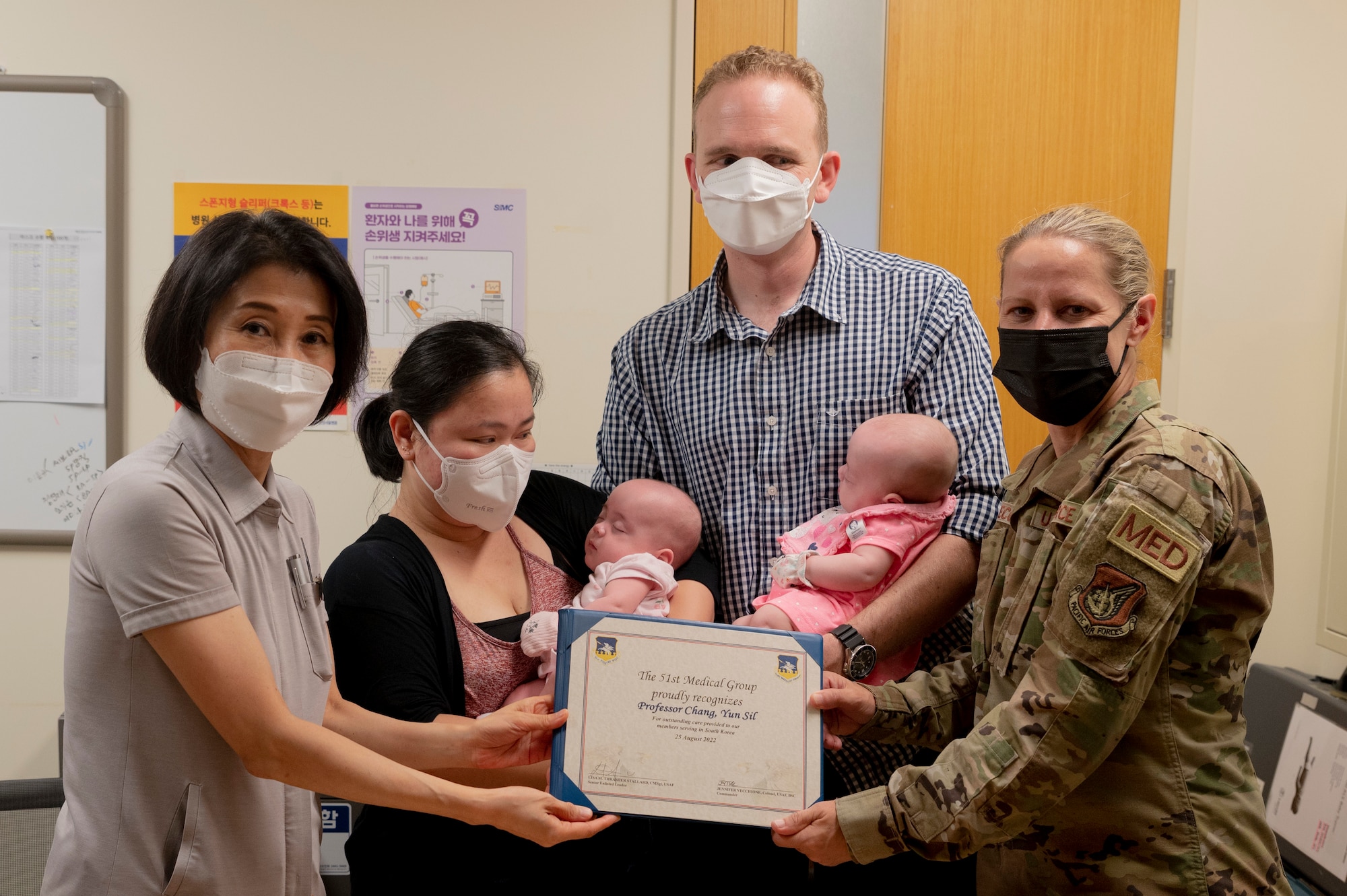 Col. Jennifer Vecchione, 51st Medical Group Commander, presents Professor Yun Sil Chang, lead Neonatal Intensive Care Unit (NICU)  physician, with a certificate of appreciation at the Samsung Seoul Hospital, Republic of Korea.