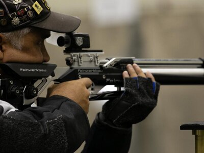 Retired U.S. Army Maj. William Hammac takes aim at his target during the 2022 Department of Defense Warrior Games at the Orange County Convention Center, in Orlando, Florida, Aug. 20, 2022. Hosted by the U.S. Army at the Walt Disney World Resort, this year’s Warrior Games sees service members and veterans from across the DoD competing in a variety of adaptive sports alongside armed forces athletes from Canada and Ukraine.