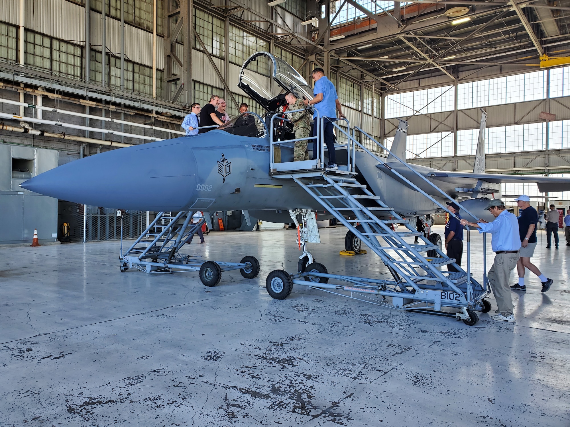 Members of the F-15 Program Office check out an F-15 aircraft during  a ceremony on July 28, 2022, to mark 50 years of flight. (U.S. Air Force photo/ Brian Brackens)