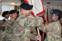 The exact moment Command Sgt. Maj. Terrell Brisentine officially became the command sergeant major of the 405th AFSB was symbolized by Col. Crystal Hills’ action as she passed the brigade colors to him.