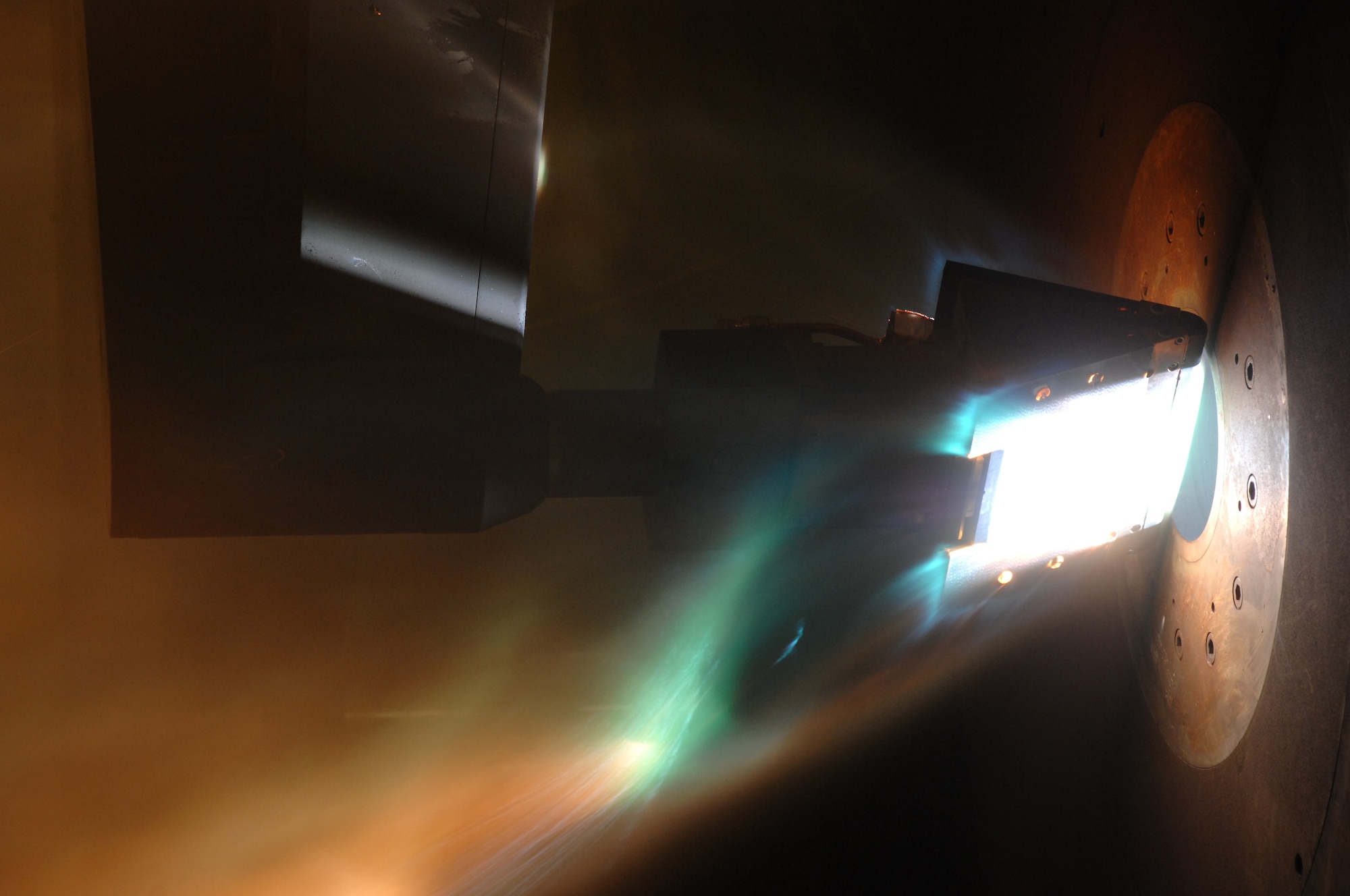 An Orion Crew Exploration Vehicle heat shield material sample undergoes preproduction aerothermal testing in the Arnold Engineering Development Complex H2 arc jet test facility at Arnold Air Force Base. (U.S. Air Force photo)
