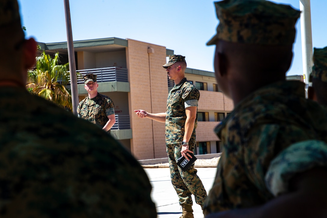 U.S. Marine Corps 1st Lt. Jacob Carmin, legal assistance section head, Legal Services Support Team Twentynine Palms (LSST-29 Palms), Headquarters Battalion, Marine Air Ground Task Force Training Command, gives a legal brief to Marine Corps Communication-Electronics School students at Marine Corps Air Ground Combat Center, Twentynine Palms, California, April 13, 2022. LSST-29 Palms met with the students for a weekly brief on available legal assistance services to ensure they step off on the right foot towards a successful military career. (U.S. Marine Corps photo by Lance Cpl. Jacquilyn Davis)