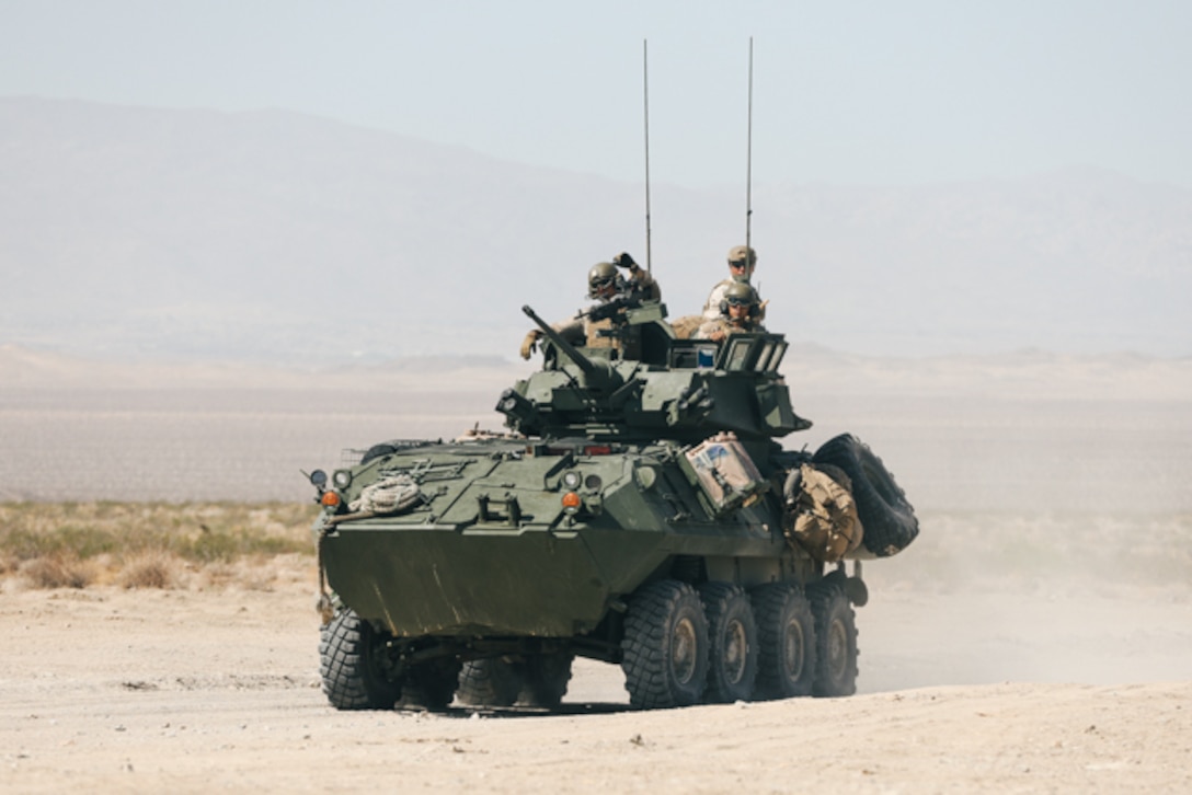 U.S. Marines with 3rd Light Armored Reconnaissance (LAR) Battalion, 1st Marine Division, drive a light armored vehicle (LAV) to a firing point during a live-fire exercise at Marine Corps Air Ground Combat Center, Twentynine Palms, California, Aug. 11, 2022. The Marines conducted LAV intermediate gunnery training for LAV crew qualifications. (U.S. Marine Corps photo by Lance Cpl. Andrew Bray)