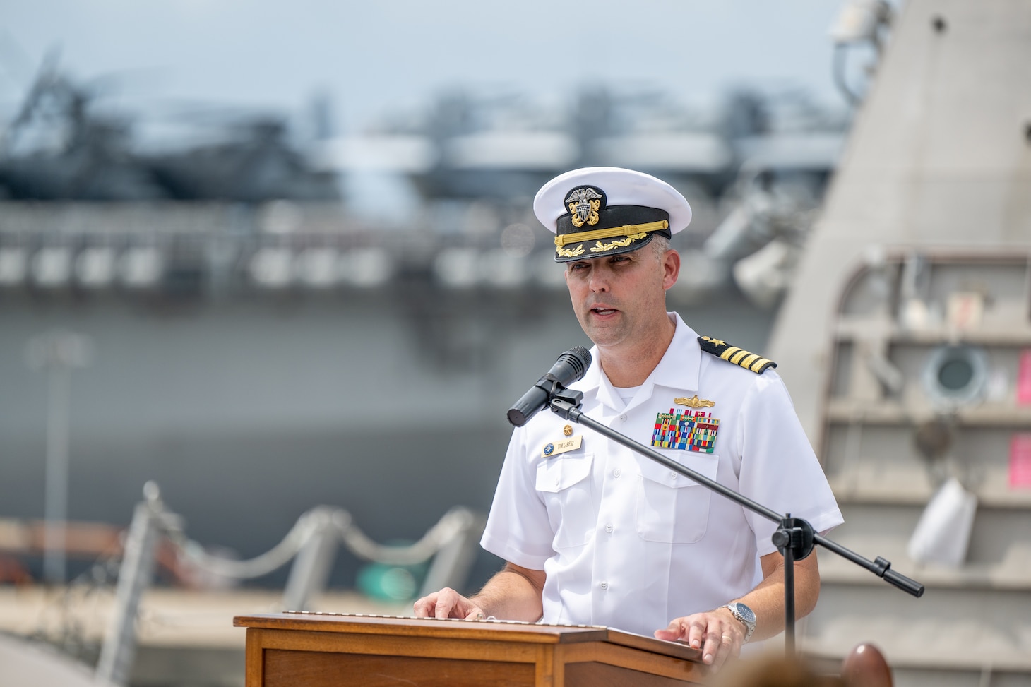 Capt. Tim LaBenz, commodore, Destroyer Squadron (DESRON) 7, speaks during the DESRON 7 change of command ceremony aboard the Independence-variant littoral combat ship USS Charleston (LCS 18) where he relieved Capt. Tom Ogden in Singapore, Sept. 2, 2022. Charleston, part of DESRON 7, is on a rotational deployment, operating in the U.S. 7th Fleet area of operations to enhance interoperability with partners and serve as a ready-response force in support of a free and open Indo-Pacific region. As the U.S. Navy’s destroyer squadron forward-deployed in Southeast Asia, DESRON 7 serves as the primary tactical and operational commander of littoral combat ships rotationally deployed to Singapore, Expeditionary Strike Group (ESG) 7’s Sea Combat Commander, and builds partnerships through training exercises and military-to-military engagements.