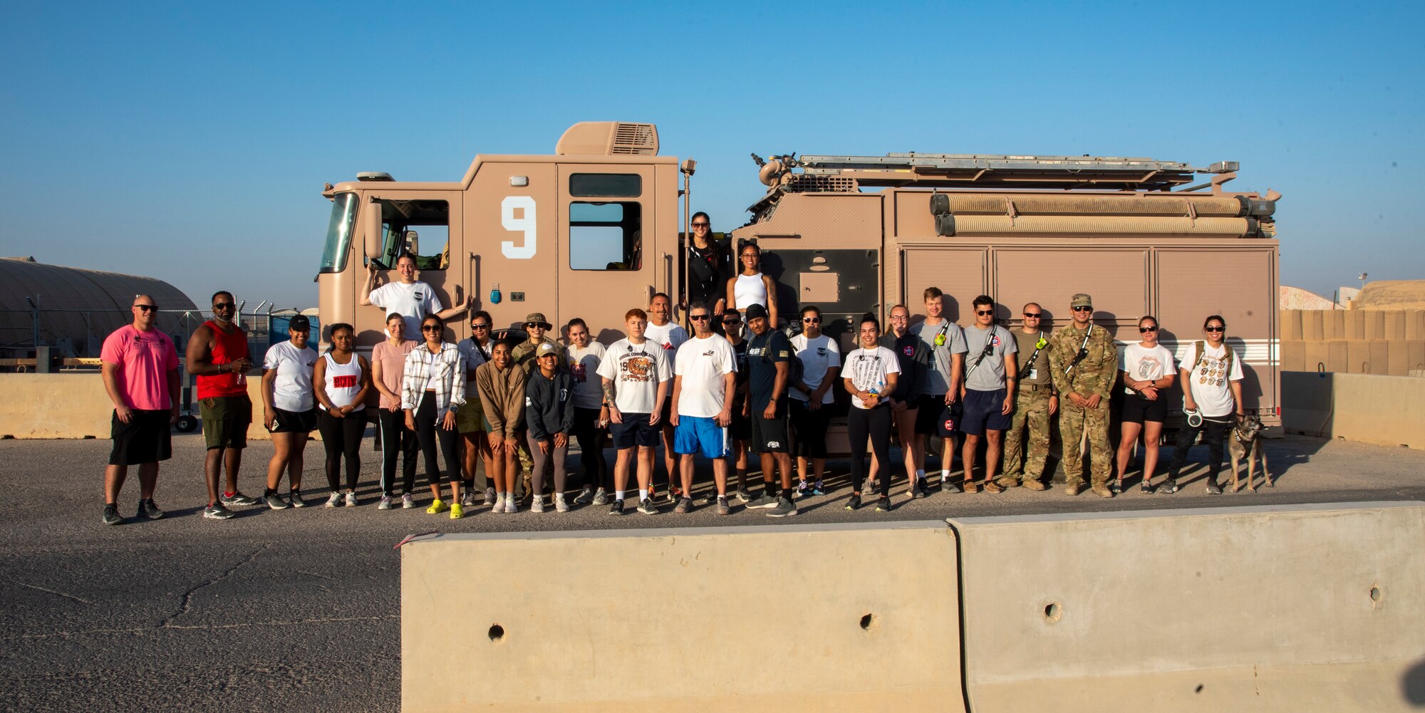Airmen with the 332d Aerial Expeditionary Wing participate in a five kilometer run, brunch and barbecue dinner in honor of Women's Equality Day at an undisclosed location in Southwest Asia, August 26, 2022.