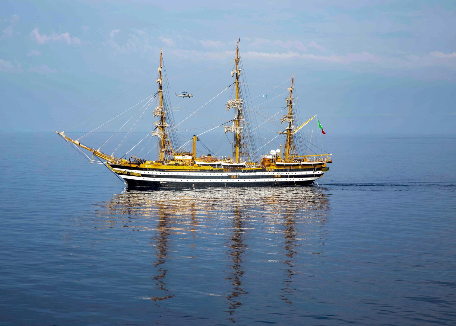 The Italian training ship ITS Amerigo Vespucci sails alongside the Nimitz-class aircraft carrier USS George H.W. Bush (CVN 77), Sep. 1, 2022.