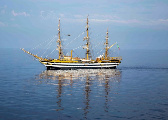 The Italian training ship ITS Amerigo Vespucci sails alongside the Nimitz-class aircraft carrier USS George H.W. Bush (CVN 77), Sep. 1, 2022.