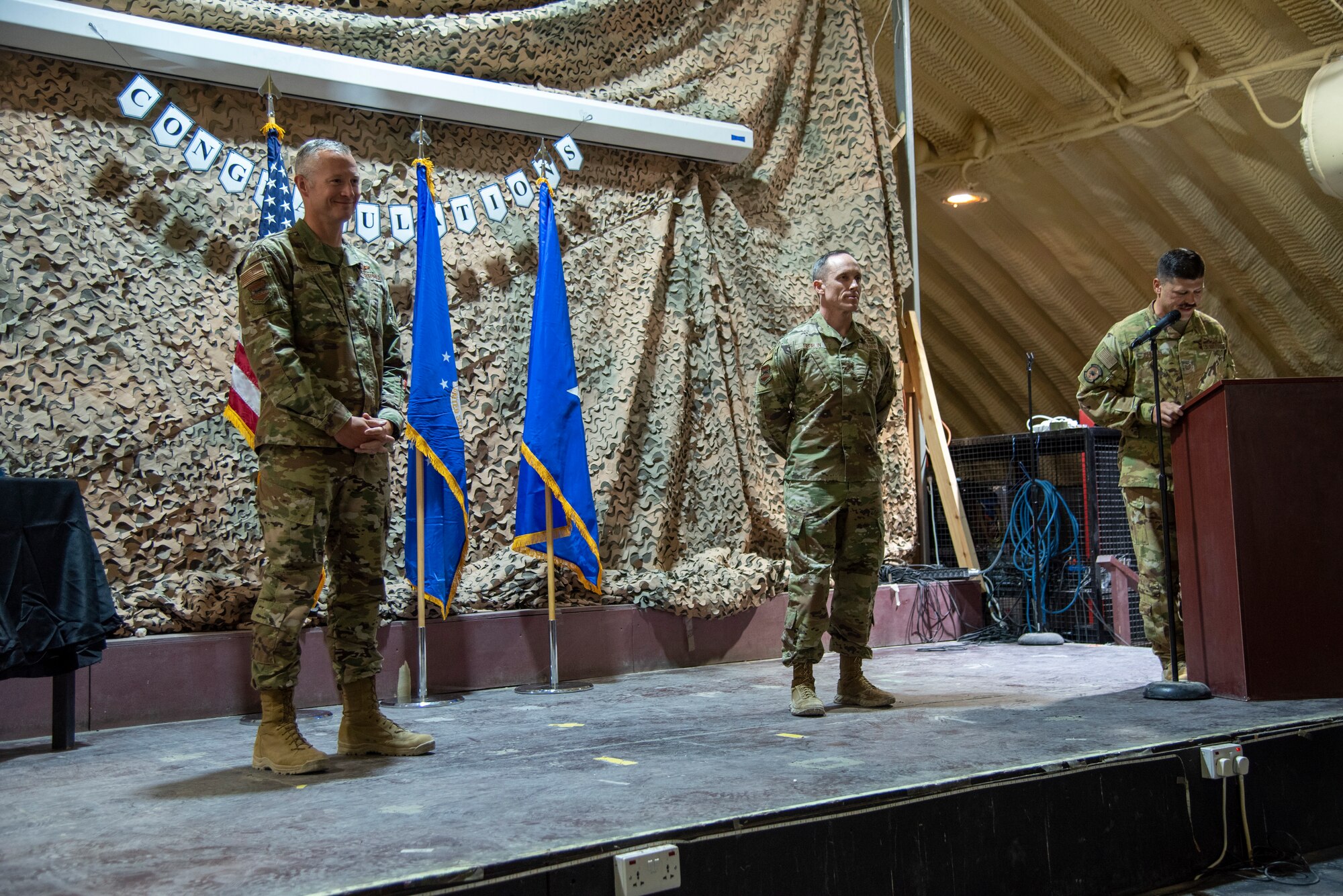 332d Aerial Expeditionary Wing leadership honors the senior airmen who have been selected for promotion to the rank of staff sergeant at an undisclosed location in Southwest Asia, August 30, 2022. (U.S. Air Force photo by: Tech. Sgt. Jim Bentley)