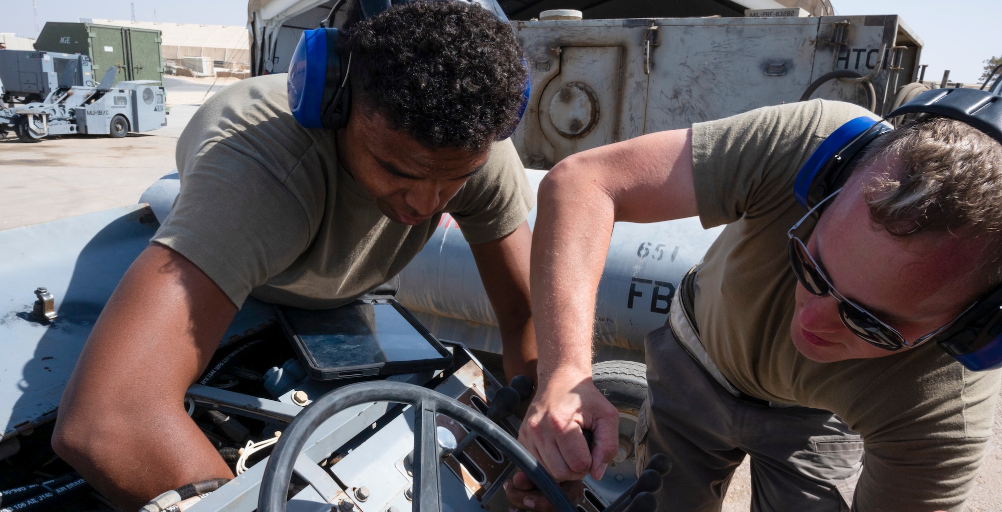 U.S. Air Force Brig. Gen. Ryan Messer and 332d Aerial Expeditionary Wing leadership visit the fabrication shop, 332d Aerospace Ground Equipment at an undisclosed location in Southwest Asia, August 22, 2022. AGE is responsible for repairing, fabricating or replacing the parts and equipment needed to carry out flight missions. These immersion visits provide greater insight into the unique skillsets every airman brings to the 332d AEW Red Tail team. (U.S. Air Force photo by: 1st Lt. Michael Luangkhot)