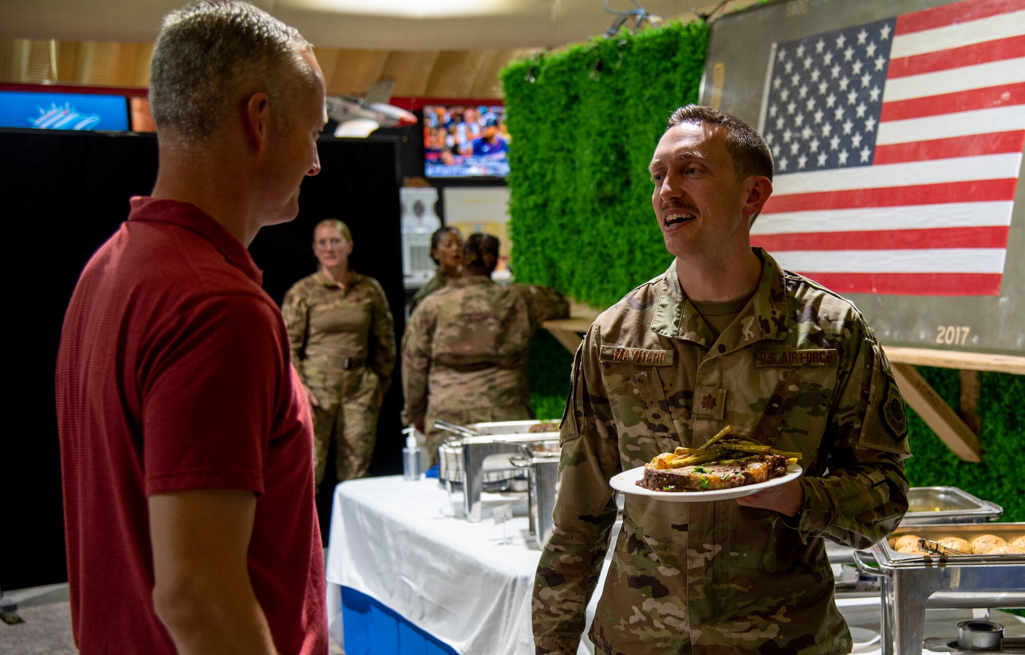 332d Aerial Expeditionary Wing leadership honors Airman of the Month award winners with a banquet at an undisclosed location in Southwest Asia, August 24, 2022. These airmen are being recognized for performing above and beyond their typical duties. (U.S. Air Force photo by: Tech. Sgt. Jim Bentley)