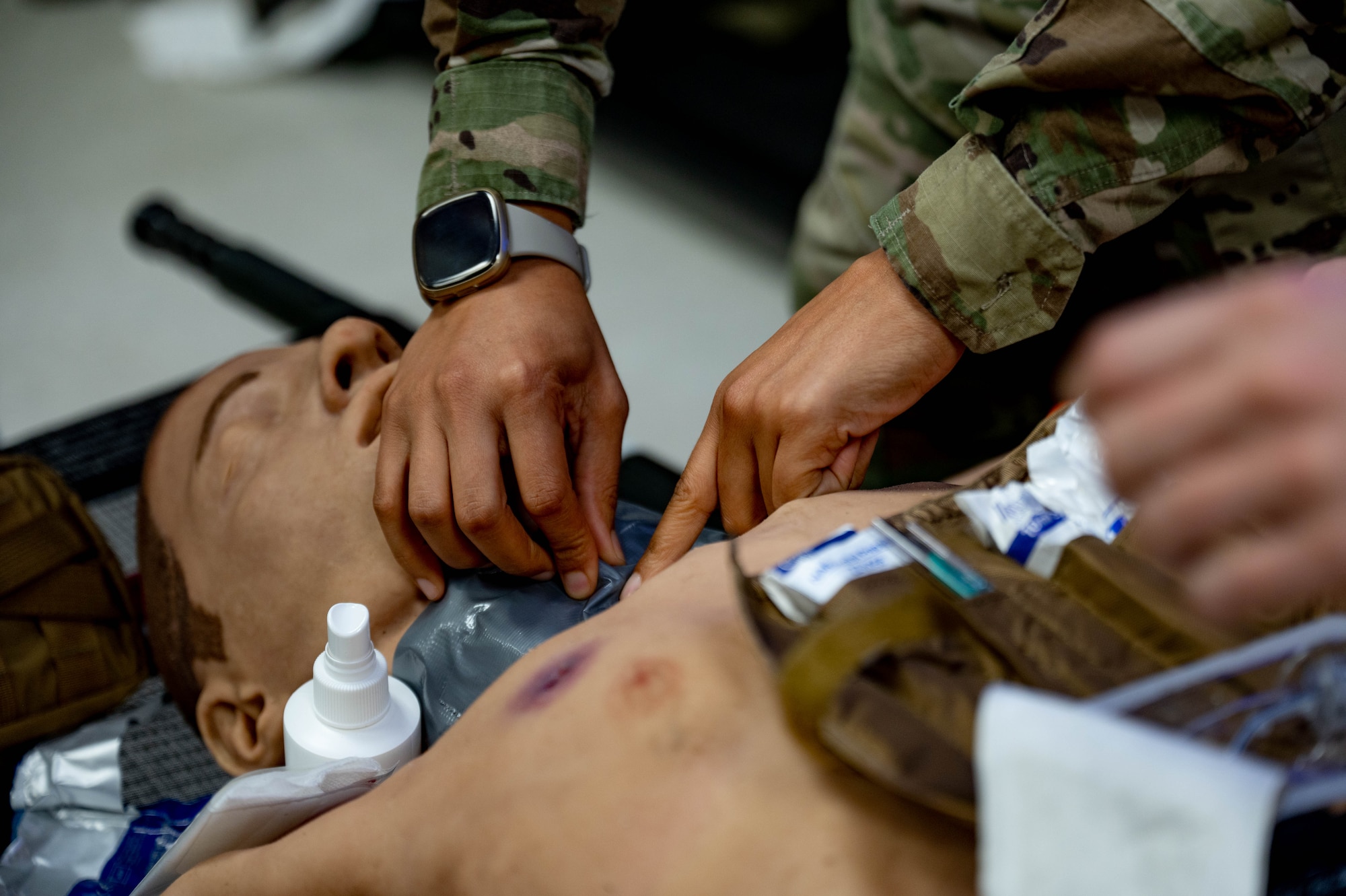 Airman cuts into manikin.