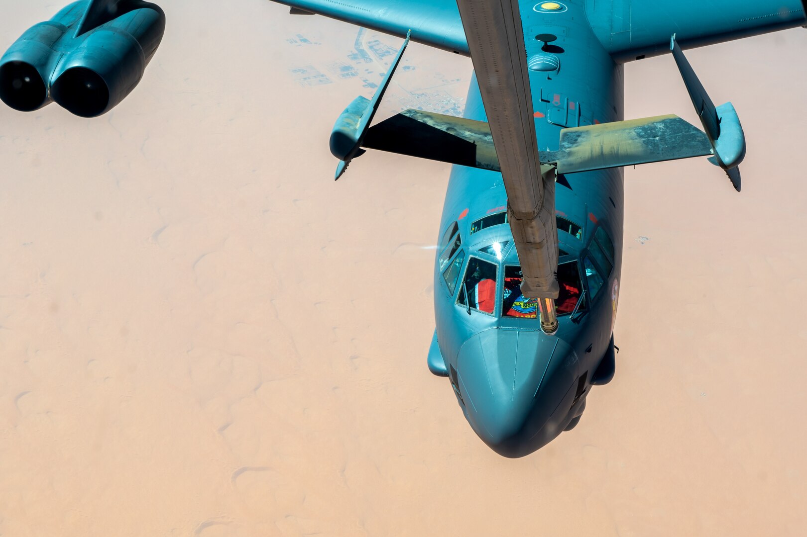 A U.S. Air Force B-52H Stratofortress, assigned to the 5th Bomb Wing, Minot Air Force Base, North Dakota, approaches a KC-10 Extender assigned to the 908th Expeditionary Air Refueling Squadron, Prince Sultan Air Base, Kingdom of Saudi Arabia, for air refueling support, during a Bomber Task Force mission, over the U.S. Central Command area of responsibility, Sept. 4, 2022. BTF missions demonstrate the U.S.’s commitment to regional security and stability by showing how the U.S. will decisively respond to threats against U.S., coalition and partner forces. (U.S. Air Force photo by Staff Sgt. Shannon Bowman)