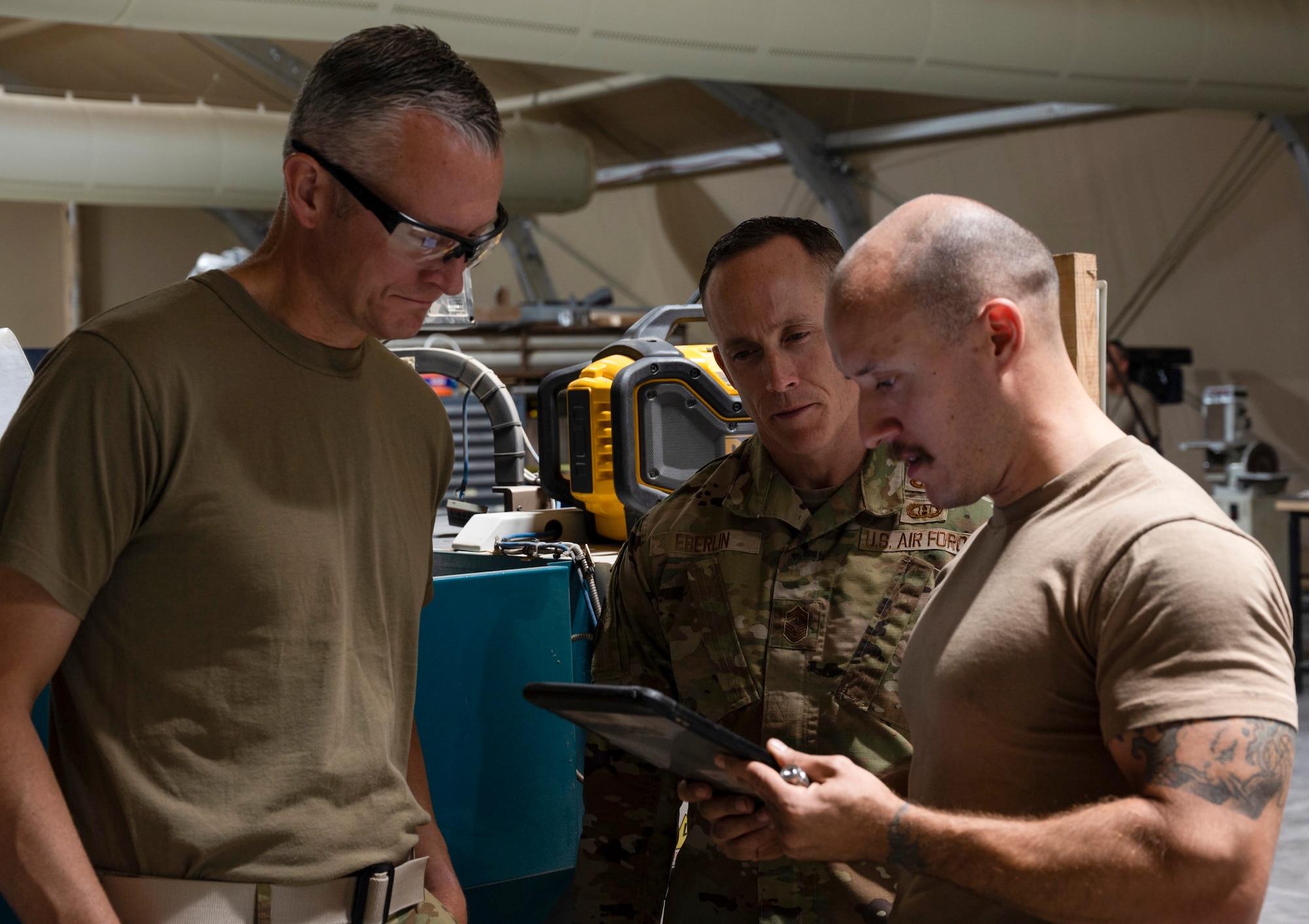 U.S. Air Force Brig. Gen. Ryan Messer and 332d Aerial Expeditionary Wing leadership visit the fabrication shop, 332d Aerospace Ground Equipment at an undisclosed location in Southwest Asia, August 22, 2022. AGE is responsible for repairing, fabricating or replacing the parts and equipment needed to carry out flight missions. These immersion visits provide greater insight into the unique skillsets every airman brings to the 332d AEW Red Tail team. (U.S. Air Force photo by: 1st Lt. Michael Luangkhot)