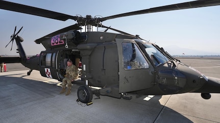 Sgt. 1st Class Mark Carter sits in his HH-60 Medevac Black Hawk helicopter on standby for a mission at Medford Airport, Ore., Sept. 2, 2022. Oregon National Guard members were supporting firefighting efforts at the Rum Creek wildfire.