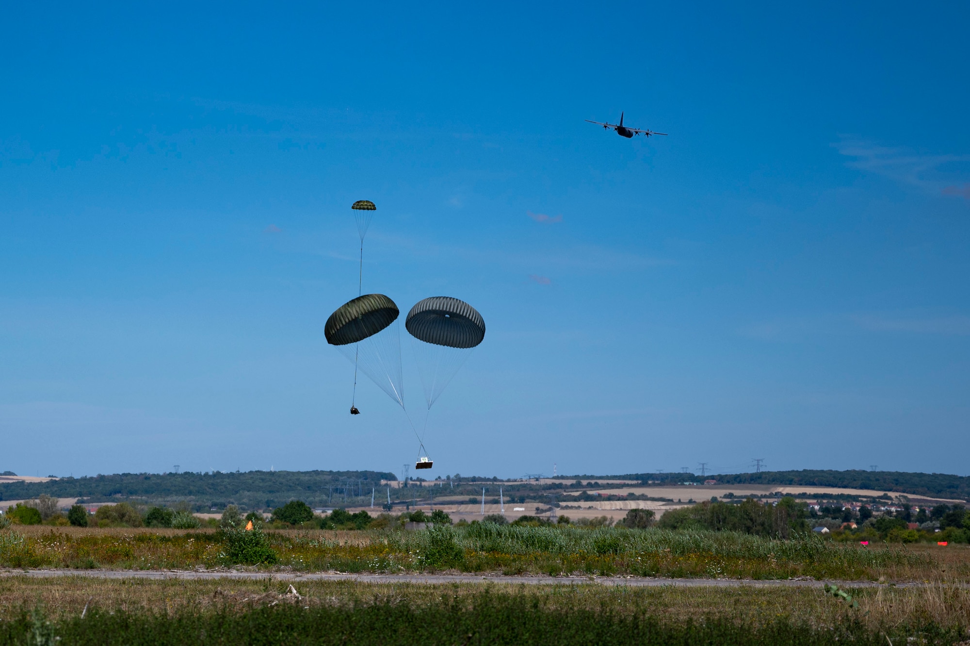 A U.S. Air Force C-130J Super Hercules assigned to the 37th airlift squadron conducts an airdrop at Base Aérienne Grostenquin, France, Aug. 26, 2022.