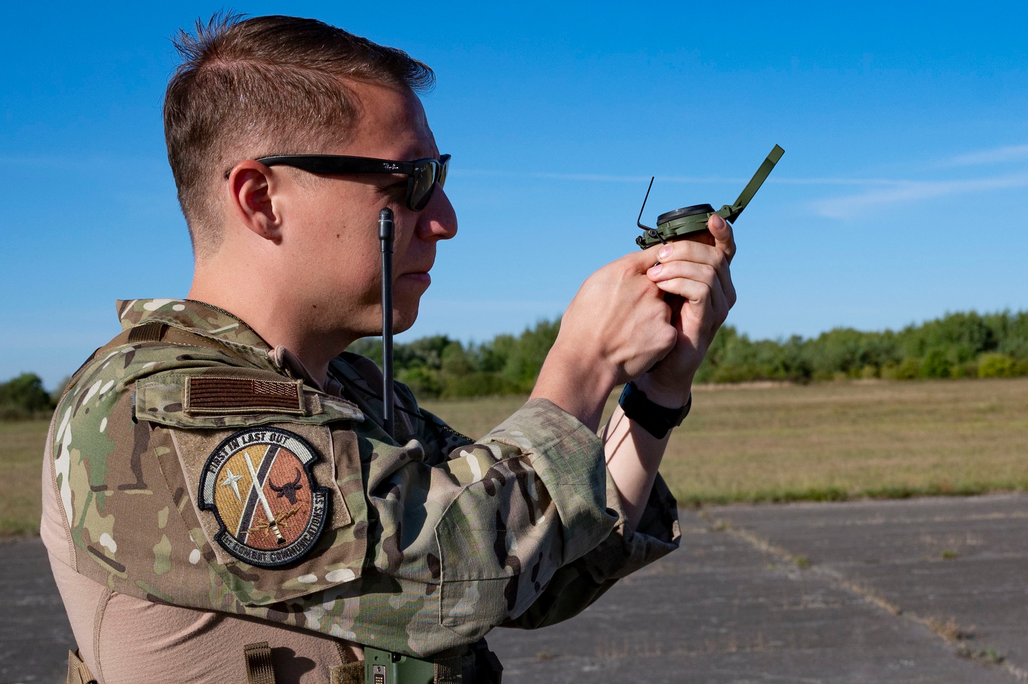 U.S. Air Force Staff Sgt. Patrick Griffith, 1st Combat Communications Squadron contingency air traffic controller, takes measurements for the first training session with the 37th Airlift Squadron using mobile Link 16 equipment at Base Aérienne Grostenquin, France, Aug. 26, 2022.