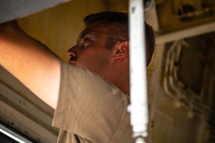 U.S. Air Force Staff Sgt. Garrett Byers, 6th Maintenance Squadron hydraulics specialist from MacDill Air Force Base, Florida, inspects the hydraulic system on a KC-135 Stratotanker aircraft during the 6th Air Refueling Wing’s Agile Combat Employment capstone exercise at Joint Base Charleston, South Carolina, Aug. 25, 2022. Joint Base Charleston served as one of the operational hubs during the exercise.  (U.S. Air Force photo by Airman 1st Class Christian Silvera)