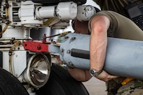 U.S. Air Force Airman 1st Class Blayne Delp, 6th Maintenance Squadron aircraft propulsion apprentice from MacDill Air Force Base, Florida, ensures a tow bar is properly placed on the axle of a KC-135 Stratotanker during the 6th Air Refueling Wing’s Agile Combat Employment capstone exercise at Joint Base Charleston, South Carolina, Aug. 25, 2022. One aspect of the training experience simulated a KC-135 aircraft flying 24/7, landing only to refuel and to be inspected for visual damage. (U.S. Air Force photo by Airman 1st Class Christian Silvera)