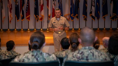 NEWPORT, R.I. (Aug. 31, 2022) Rear Adm. Pete Garvin, commander, Naval Education and Training Command, speaks with the staff of Officer Training Command Newport (OTCN), Aug. 31, 2022. Garvin visited Naval Station Newport Aug. 31- Sept. 1 to engage with the staff and students of Center for Service Support, Surface Warfare Schools Command, Senior Enlisted Academy, OTCN, Naval Chaplaincy School, Naval Leadership and Ethics Center, and Navy Supply Corps School. (U.S. Navy photo by Mass Communication Specialist 2nd Class Derien C. Luce)