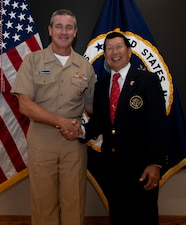 NEWPORT, R.I. (Sept. 1, 2022) Rear Adm. Pete Garvin, commander, Naval Education and Training Command, left, poses for a photo with retired Senior Chief Mess Management Specialist Tony Cercena, after the graduation ceremony for Senior Enlisted Academy (SEA) class 254 on Naval Station (NAVSTA) Newport, Sept. 1, 2022. Garvin visited NAVSTA Newport Aug. 31-Sept. 1 to speak with the staff and students of Center for Service Support, Surface Warfare Schools Command, SEA, Officer Training Command Newport, Naval Chaplaincy School, Naval Leadership and Ethics Center, and Navy Supply Corps School. (U.S. Navy photo by Mass Communication Specialist 2nd Class Derien C. Luce)