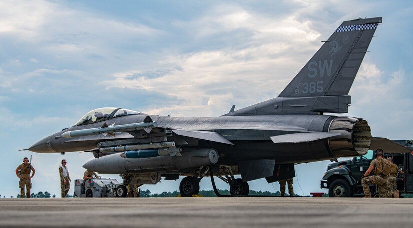 Airmen work on a F-16.