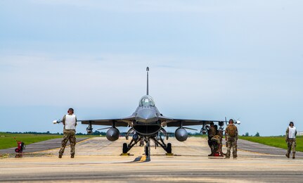 Airmen work on an F-16