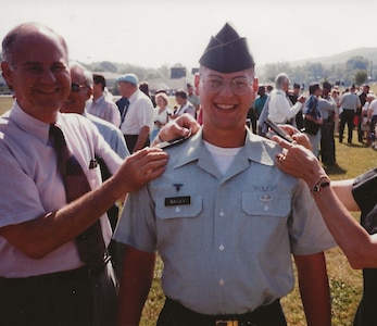 John “Ryan” Bailey receives his shoulder boards from his parents, John and Linda Bailey, as he’s commissioned as 2nd lieutenant in the Army Medical Service Corps in 1993.