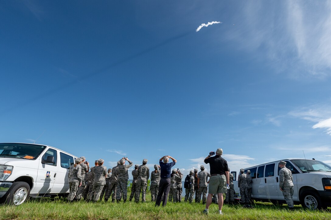 U.S. Space Force Brig. Gen. Stephan Purdy, Space Launch Delta 45 commander, and cadets with the Civil Air Patrol Space Force Operations Academy watch a Falcon 9 rocket launch, July 24, 2022 at Cape Canaveral Space Force Station, Fla. This was the Starlink 4-25 mission and carried 53 satellites to space. (U.S. Space Force photo by Senior Airman Dakota Raub)