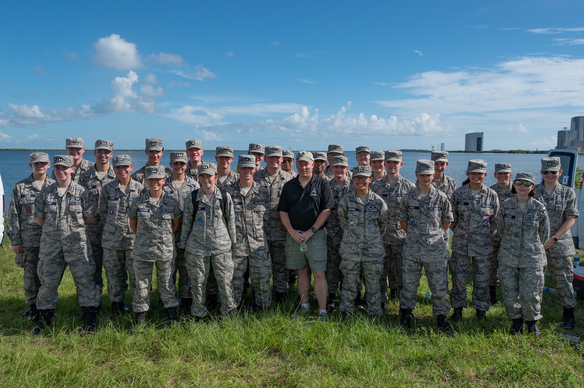 U.S. Space Force Brig. Gen. Stephan Purdy, Space Launch Delta 45 commander, and cadets with the Civil Air Patrol Space Force Operations Academy pose for a group photo, July 24, 2022 at Cape Canaveral Space Force Station, Fla. The group of cadets toured sites at Cape Canaveral SFS, Kennedy Space Center, and Patrick Space Force Base, Fla. (U.S. Space Force photo by Senior Airman Dakota Raub