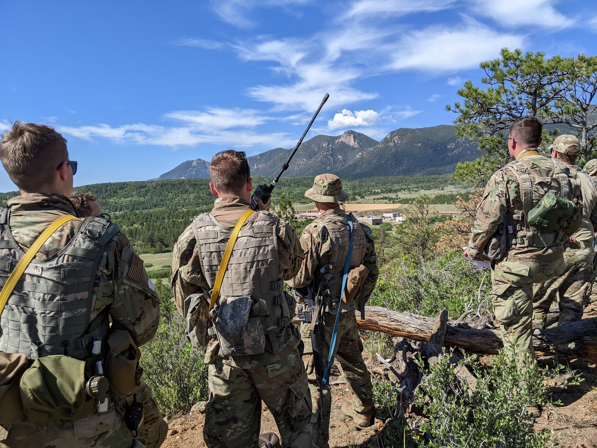 Cadets practice calling for air support as they provide overwatch for another team conducting a personnel recovery training mission during the Special Warfare Orientation Course at the U.S. Air Force Academy, Colo., June 29, 2022. SWOC students used the skills learned in the classroom in practical scenarios to grow their skills and confidence. (U.S. Air Force Academy courtesy photo)