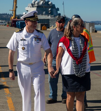 Cmdr. Erik Roberts, commanding officer of Arleigh Burke-class guided-missile destroyer USS Momsen (DDG 92), reuintes with his family on pier at Naval Station Everett, Washington, Sept. 6. The Momsen, assigned to Carrier Strike Group Three, returned following a seven-month deployment to the U.S. 3rd, 5th and 7th Fleets in support of a free and open Indo-Pacific. (U.S. Navy photo by Mass Communication Specialist 2nd Class Ethan Soto)