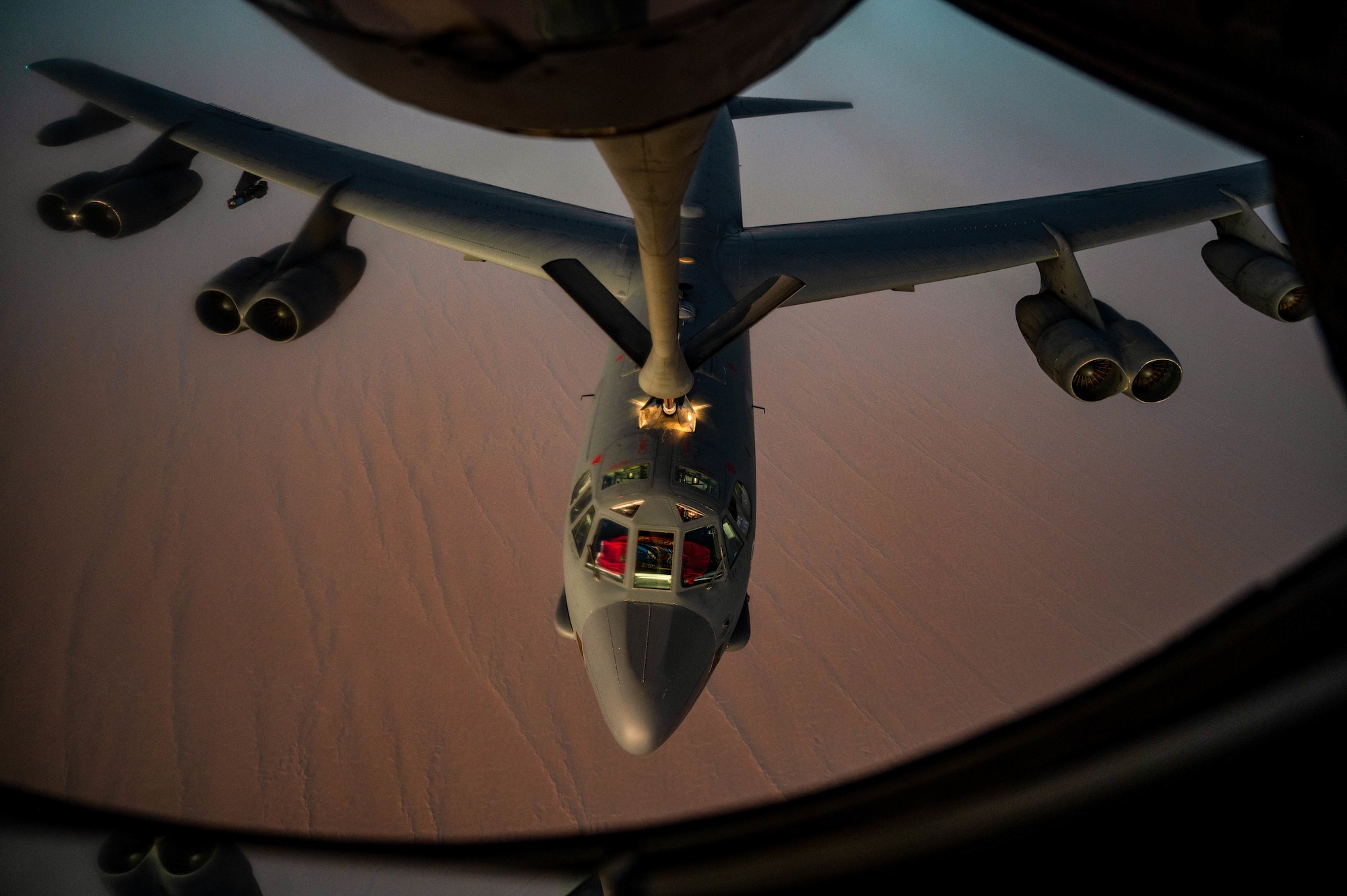 A U.S. Air Force B-52H Stratofortress, assigned to the 5th Bomb Wing, Minot Air Force Base, North Dakota, is refueled by a KC-135 Stratotanker assigned to the 340th Expeditionary Air Refueling Squadron, Al Udeid Air Base, Qatar, during a Bomber Task Force mission, over the U.S. Central Command area of responsibility, Sept. 4, 2022. BTF Missions demonstrate the U.S.’s commitment to regional security and stability by showing how the U.S. will decisively respond to threats against the U.S., coalition and partner forces. (U.S. Air Force photo by Staff Sgt. Dana Tourtellotte)