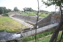 The Mill Creek Diversion Dam and fish ladder (fish ladder is under the grate) in August.  Water flows are low.
