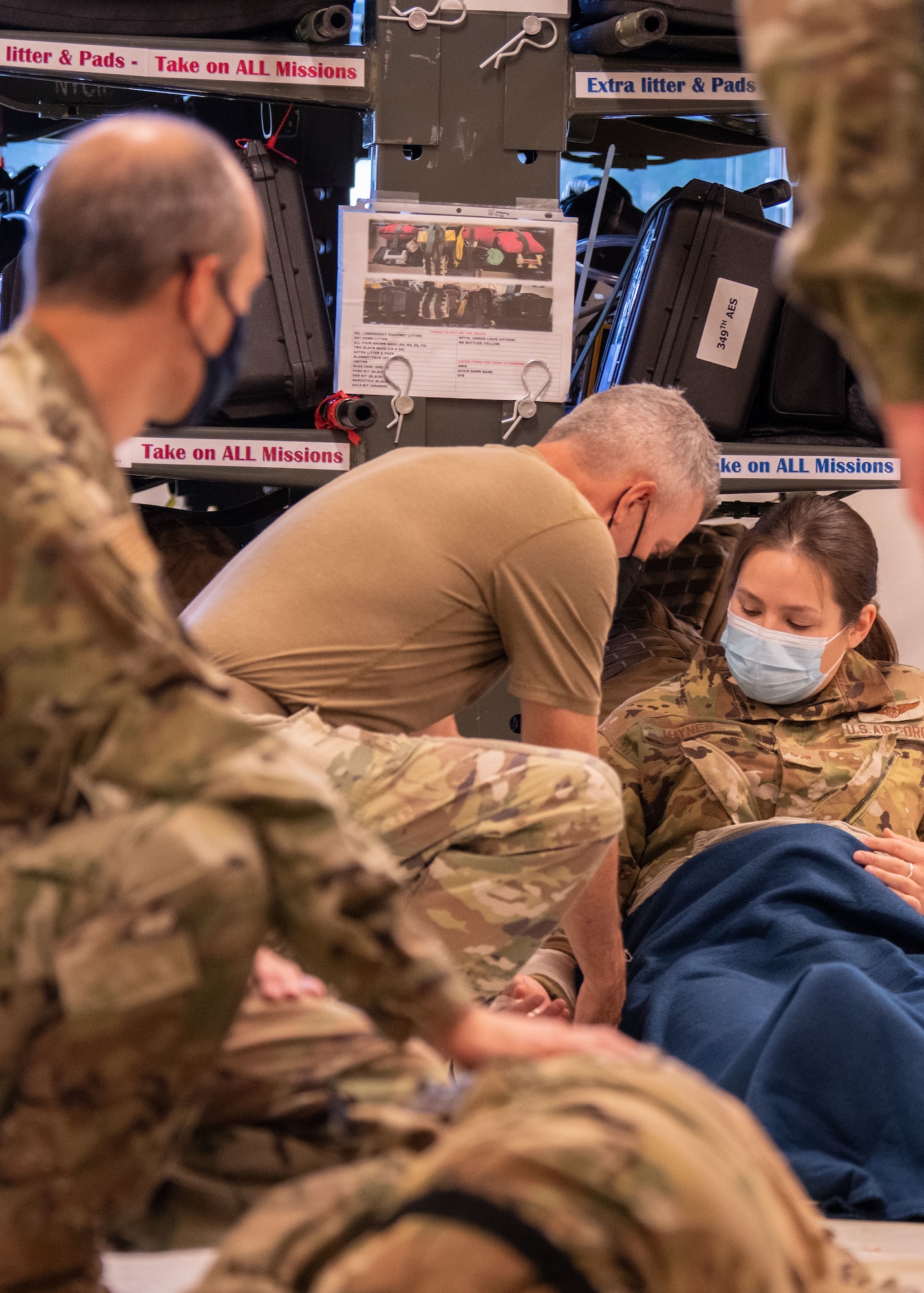 Reserve Citizen Airmen from various 349th Air Mobility Wing squadrons practice medical response scenarios during Tactical Combat Casualty Care training, July 29, 2022, at Travis Air Force Base, Calif.  TCCC teaches life-saving skills and methods proven effective in a combat environment.