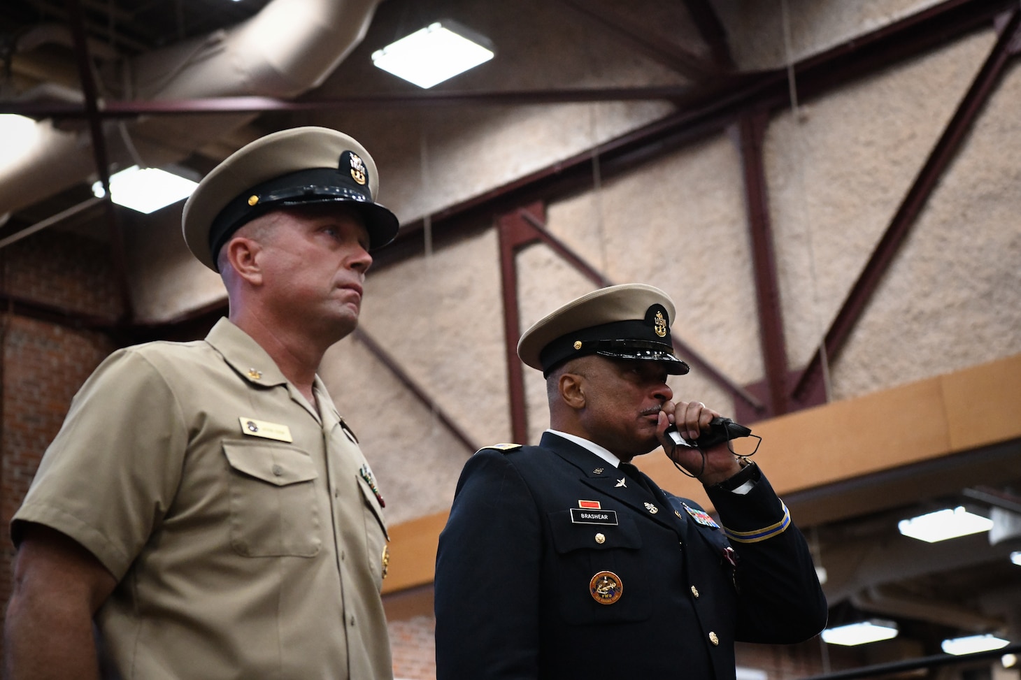 RICHMOND, Virginia (July 29th, 2022) After being appointed as an honorary Navy Chief Petty Officer,  Army Chief Warrant Officer 5 Phillip M. Brashear, son of the late Master Chief Master Diver Carl Brashear, stands next to Command Master Chief (CMDCM) Jason Cook of Mobile Diving and Salvage Unit (MDSU) Two during a special presentation by US Navy Divers during his 40-year retirement ceremony at the Frank B. Lotts Conference Center onboard Defense Supply Center in Richmond, Virginia on July 29th, 2022. Earlier in the ceremony, CW5 Brashear was appointed as an Honorary Navy Chief Petty Officer by the Master Chief Petty officer (MCPON) of the Navy Russell Smith for his relentless dedication to the United States Navy. Over the course of 17 years, CW5 Brashear inspired Sailors and members of the Chiefs Mess to keep pushing forward in the face of adversity, volunteering his service to the Navy, and accepting responsibility beyond the call of printed assignment. (U.S. Navy photo by Mass Communications Specialist 2nd Class Alexa Trafton) . (U.S. Navy photo by Mass Communications Specialist 2nd Class Alexa Trafton)