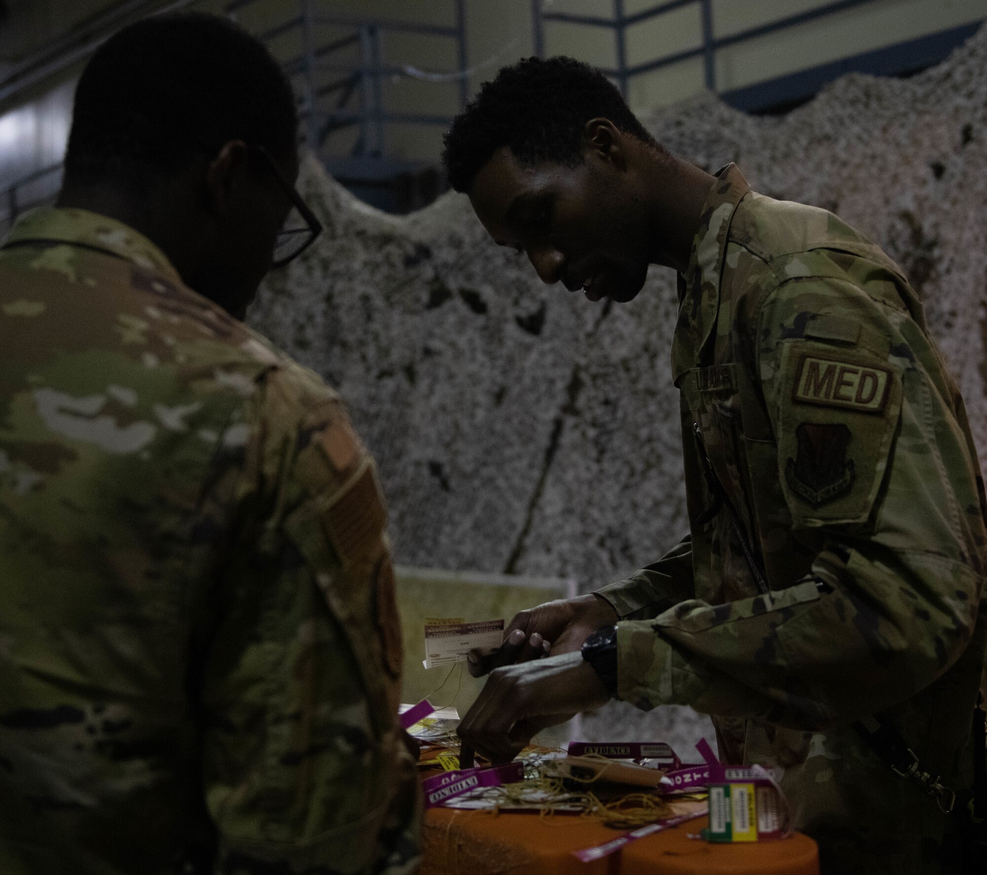 Senior Airman Keegan Jones, 319th Medical Group aerospace medical technician, sorts through triage tags during a medical training exercise Aug. 26, 2022, at Grand Forks Air Force Base, North Dakota. During the exercise, Airmen walked through a simulated plane crash determining which level of triage each victim should receive (U.S. Air Force photo by Senior Airman Phyllis Jimenez)