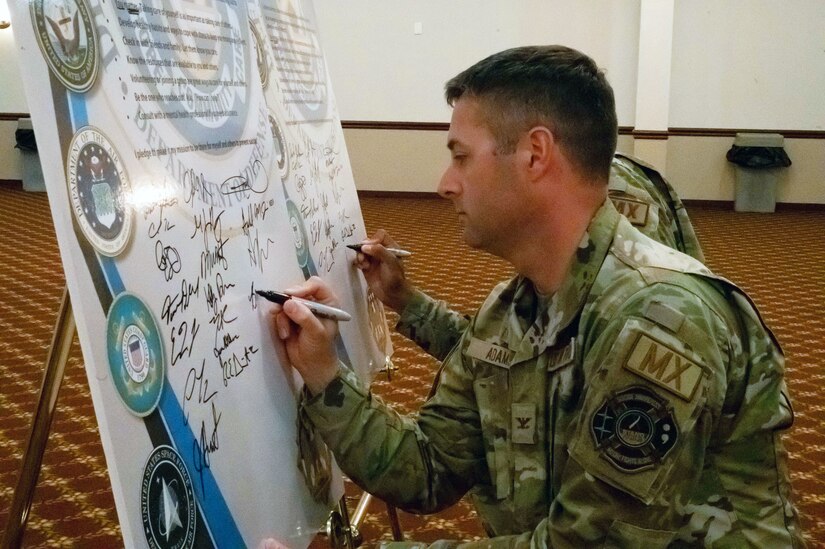 JBMDL and 87 ABW commander signs the Suicide Prevention declaration.