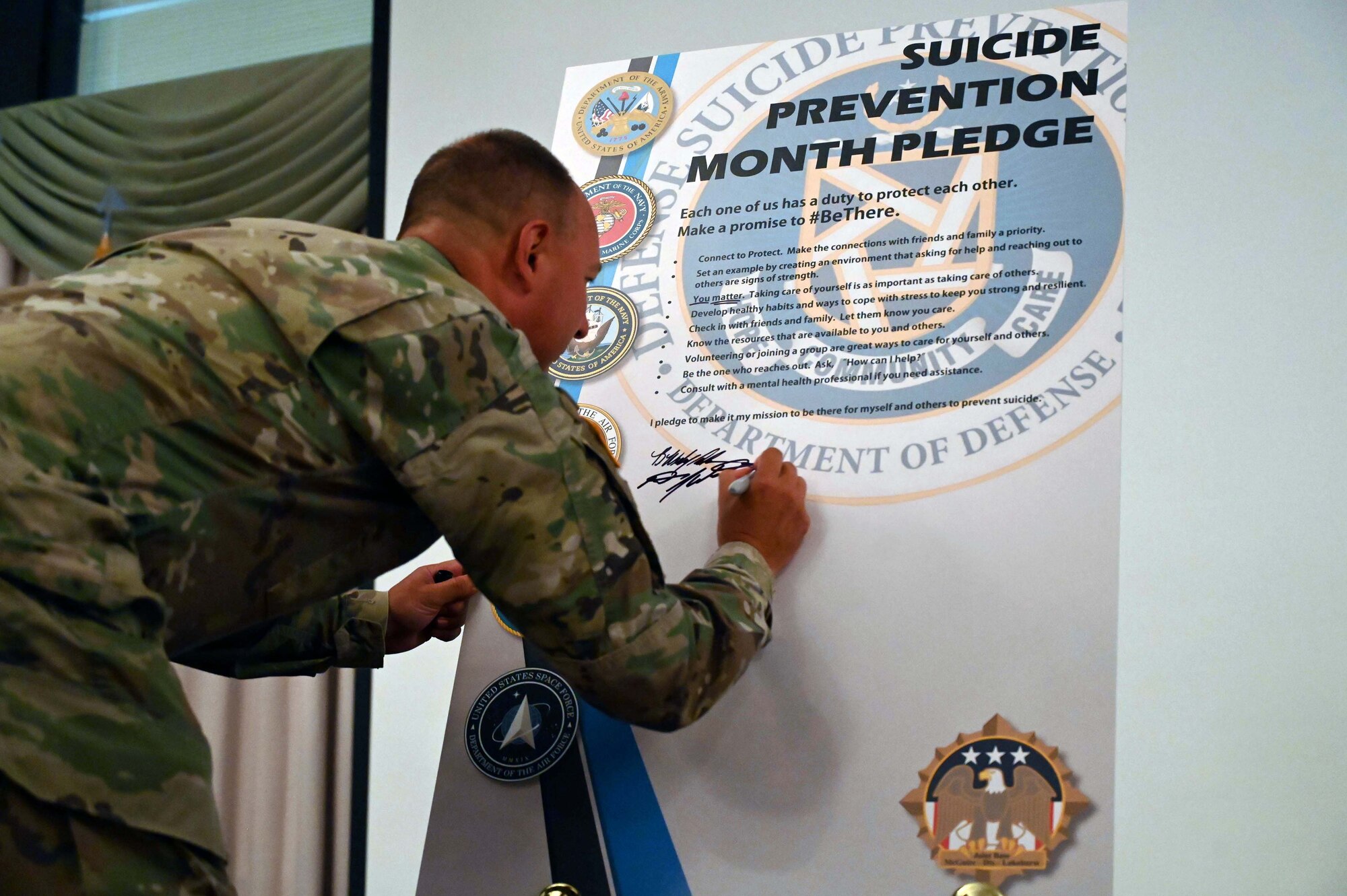 ASA commander signs the Suicide Prevention declaration.