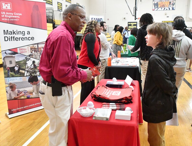 James Hathorn, U.S. Army Corps of Engineers Mobile District’s Chief of the Water management section, speaks to a student about engineering during a job fair at Lillie B. Williamson High School in Mobile, Alabama, March 28, 2022. Hathorn loves speaking to kids about choosing engineering as a career and working for USACE.