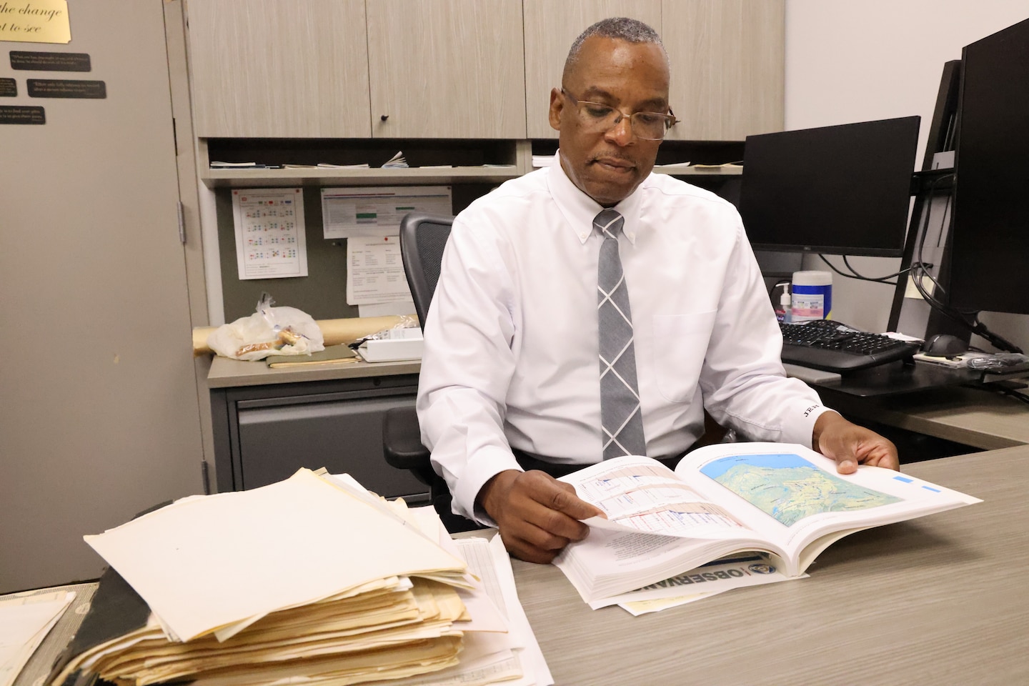 James Hathorn, U.S. Army Corps of Engineers Mobile District’s Chief of the Water Management section, reviews a water manual in his office in Mobile, Alabama, Sept. 6, 2022. Hathorn said the water management section is responsible for the release schedule for 27 dams throughout the Mobile District.