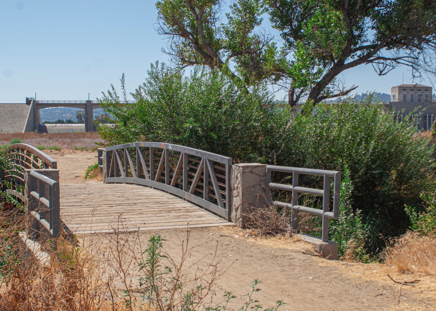 A bridged path along connects a walking trail at the Sepulveda Dam Recreational Area. The primary purpose of the dam and reservoir is flood risk management, but the project is also authorized for recreation.