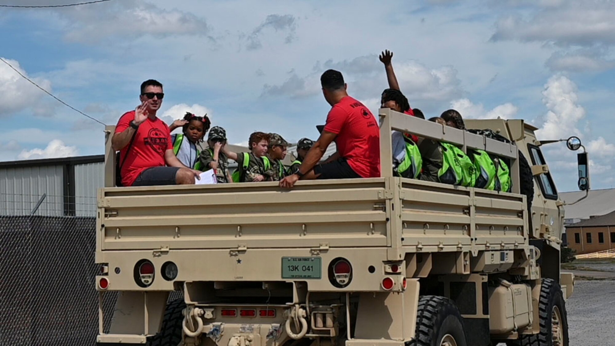 children sitting in a cargo truck