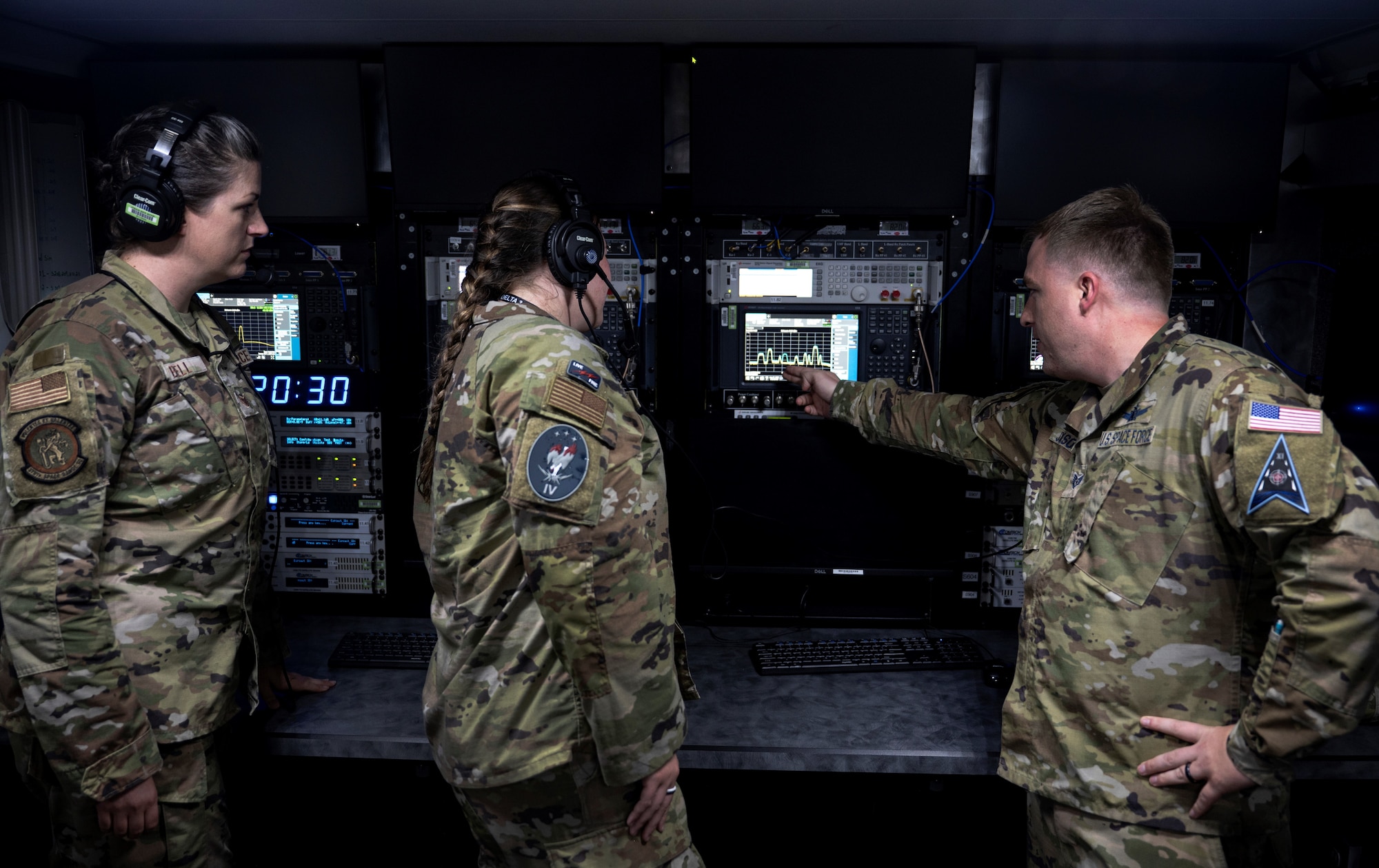 Service members from the U.S. Space Force and U.S. Air Force demonstrate the functionality of range equipment