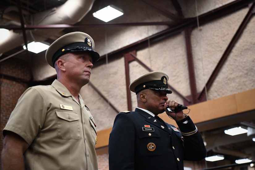 RICHMOND, Virginia (July 29th, 2022) After being appointed as an honorary Navy Chief Petty Officer,  Army Chief Warrant Officer 5 Phillip M. Brashear, son of the late Master Chief Master Diver Carl Brashear, stands next to Command Master Chief (CMDCM) Jason Cook of Mobile Diving and Salvage Unit (MDSU) Two during a special presentation by US Navy Divers during his 40-year retirement ceremony at the Frank B. Lotts Conference Center onboard Defense Supply Center in Richmond, Virginia on July 29th, 2022. Earlier in the ceremony, CW5 Brashear was appointed as an Honorary Navy Chief Petty Officer by the Master Chief Petty officer (MCPON) of the Navy Russell Smith for his relentless dedication to the United States Navy. Over the course of 17 years, CW5 Brashear inspired Sailors and members of the Chiefs Mess to keep pushing forward in the face of adversity, volunteering his service to the Navy, and accepting responsibility beyond the call of printed assignment. (U.S. Navy photo by Mass Communications Specialist 2nd Class Alexa Trafton) . (U.S. Navy photo by Mass Communications Specialist 2nd Class Alexa Trafton)