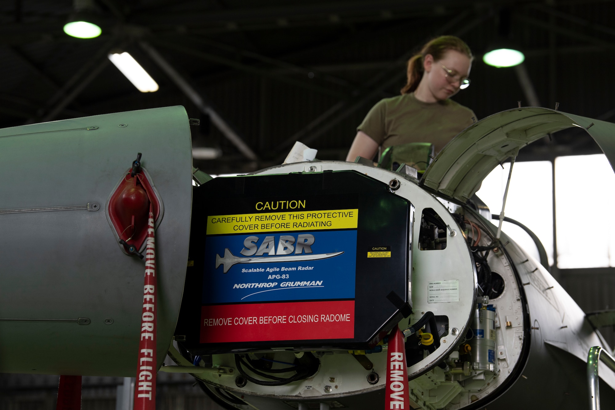 U.S. Air Force Airman performs maintenance on an F-16C Fighting Falcon.