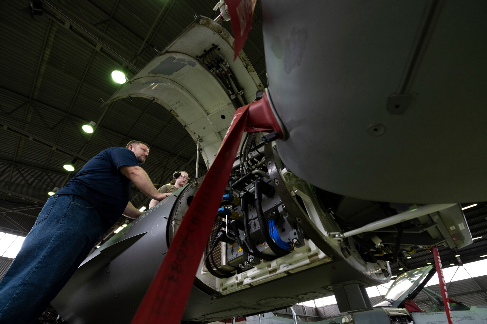 U.S. Air Force Airman performs maintenance on an F-16C Fighting Falcon.