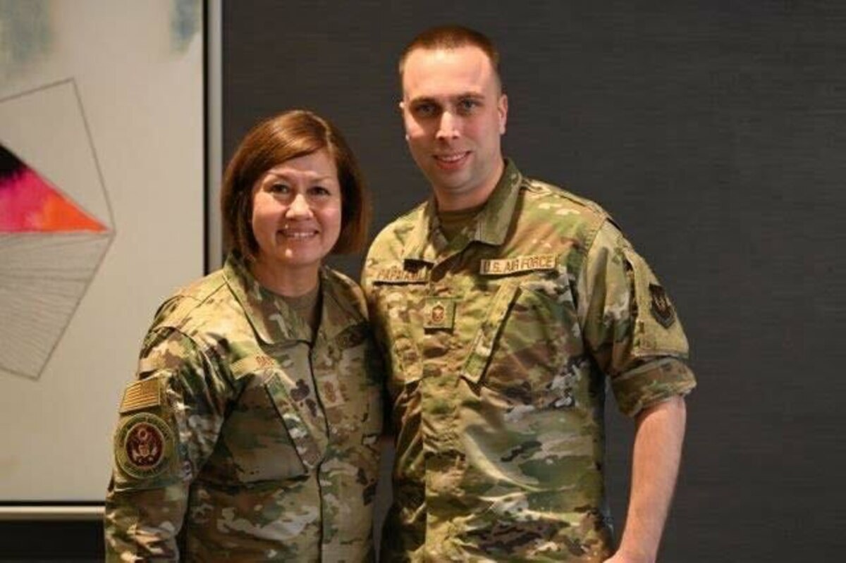 U.S. Air Force Master Sgt. Yuriy Papayanki, 97th Healthcare Operations Squadron medical administration technician, poses for a photo with JoAnne Bass, Chief Master Sgt. of the Air Force, at the Senior Enlisted Leader International Summit in Arlington, Va., Aug. 1, 2022. Papayanki directly supported various media interviews during the summit. (Courtesy photo by Master Sgt. Yuriy Papayanki)